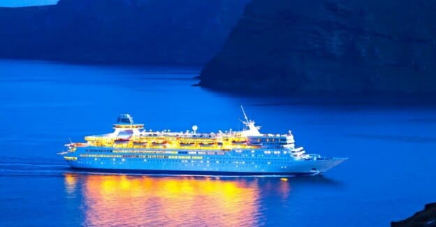 Luxury Cruise Ship Sailing At Sunset