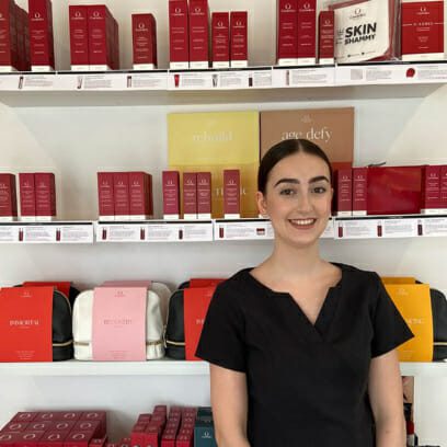 Newly graduated skin therapist selling cosmeceutical skin products at salon