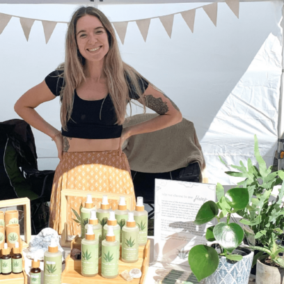 Blonde women smiling at market stall