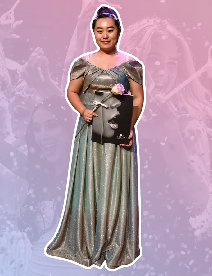 An image of a woman wearing a cap-sleeve silver metallic gown holding a pink rose and a French Beauty Academy graduation document folder. Behind her is a pink-blue gradient over the top of an image of women celebrating popping confetti filled balloons.